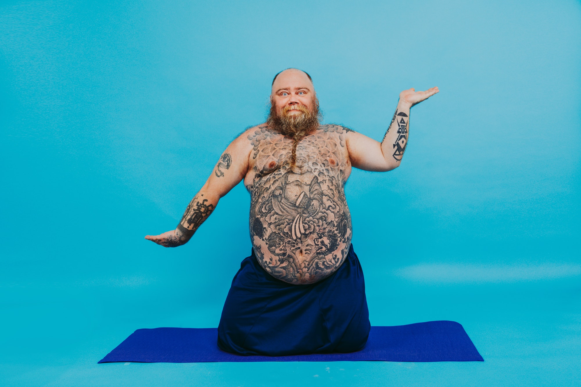 Funny fat man doing yoga meditation